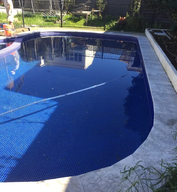 Average size dark blue pool, washing before filling with water, Lancove