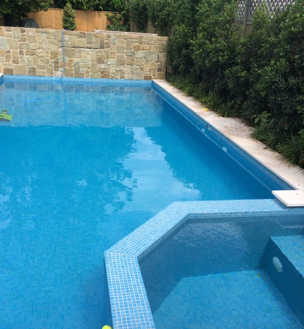 Sandstone water feature, travertine coping, nice match interior to coping, Huberfield