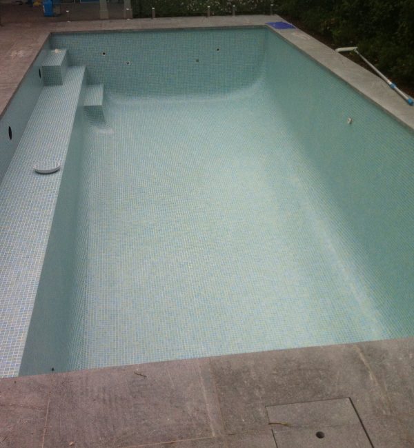 Pool without water, shows quality of tiling job, Five Dock